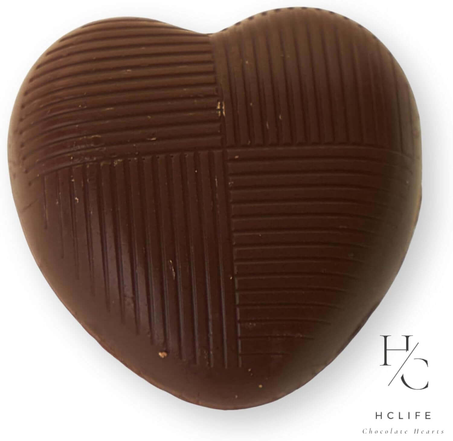 Heart-shaped chocolate with textured surface on a white background, featuring the HCLIFE logo.