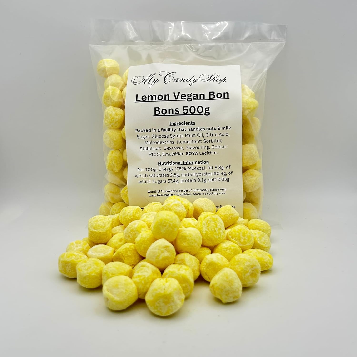 Packaged lemon vegan bonbons with a label on a white background