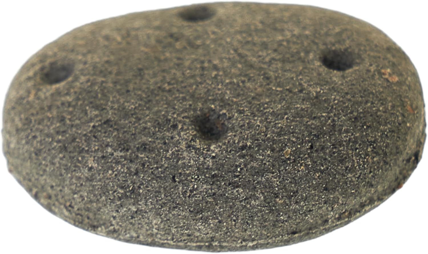 Round stone with four holes on a white background