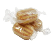 Three wrapped candies on a white background