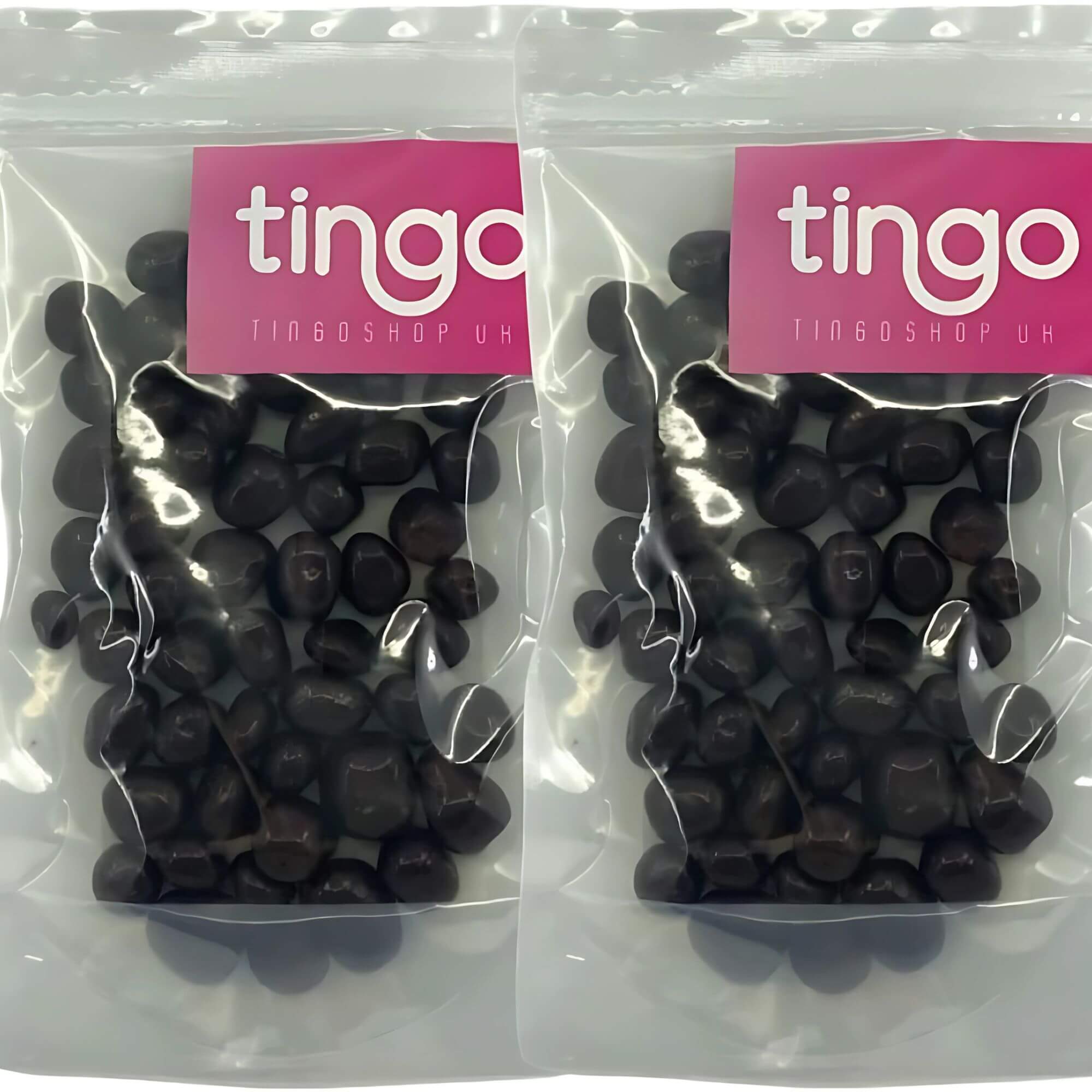 Two packages of black jelly beans with 'tingo' branding on a white background