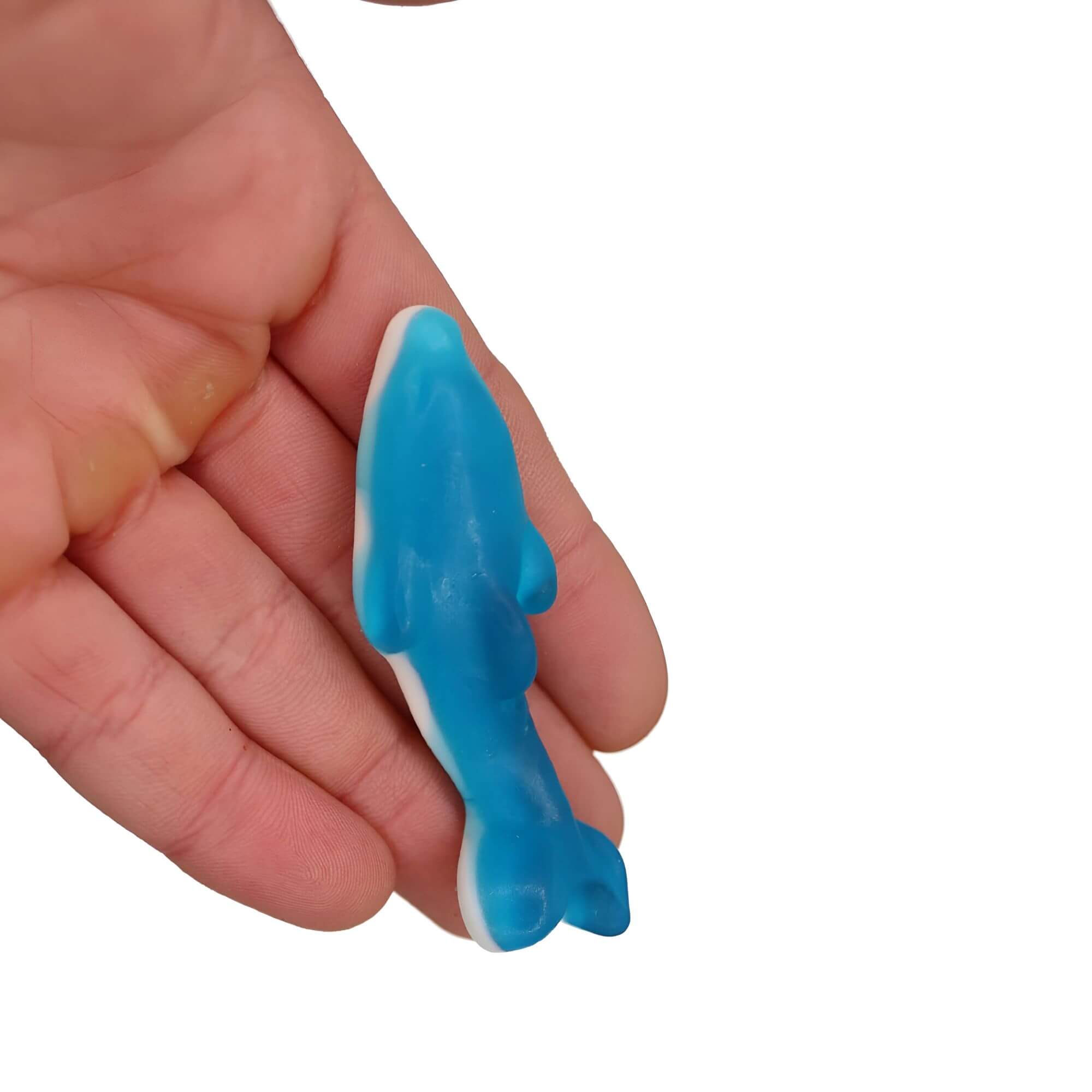 Blue shark-shaped object held in a hand against a white background