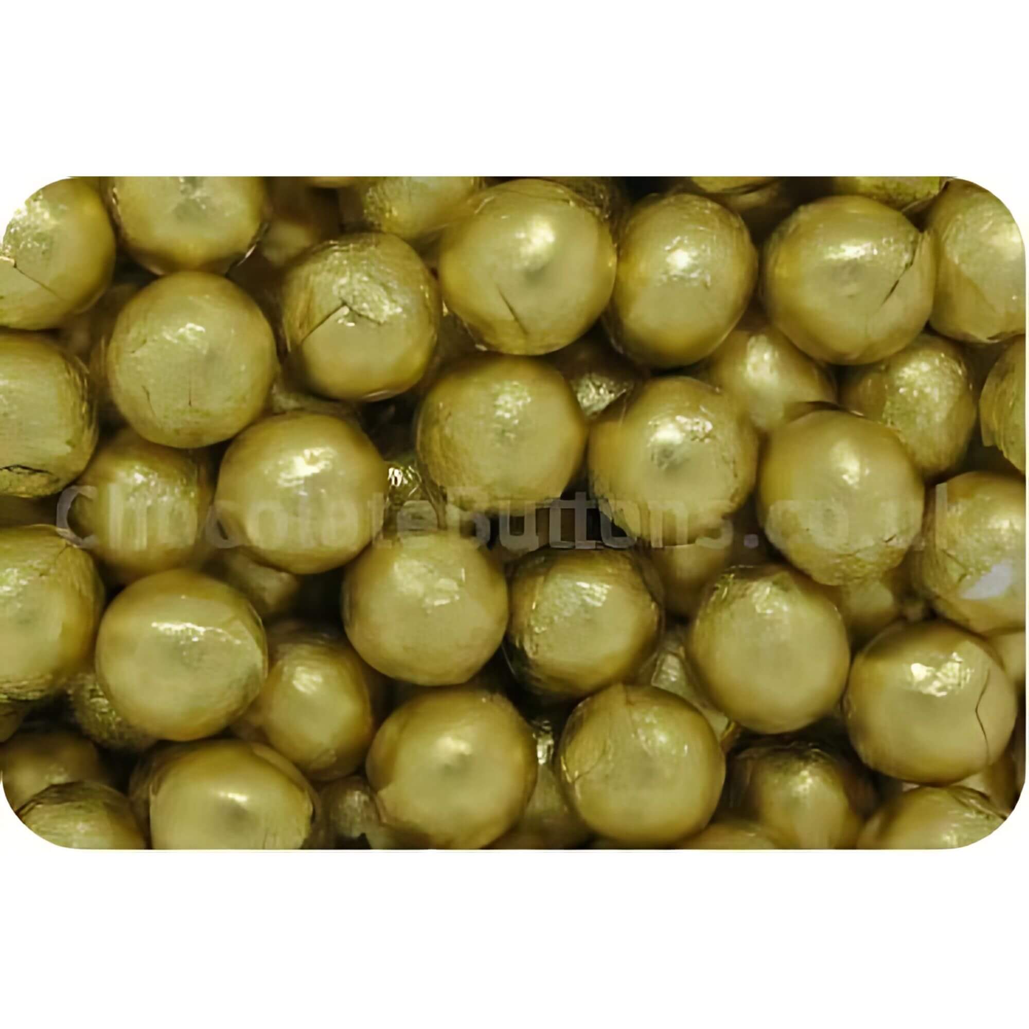 Close-up of gold-colored pearls on a white background