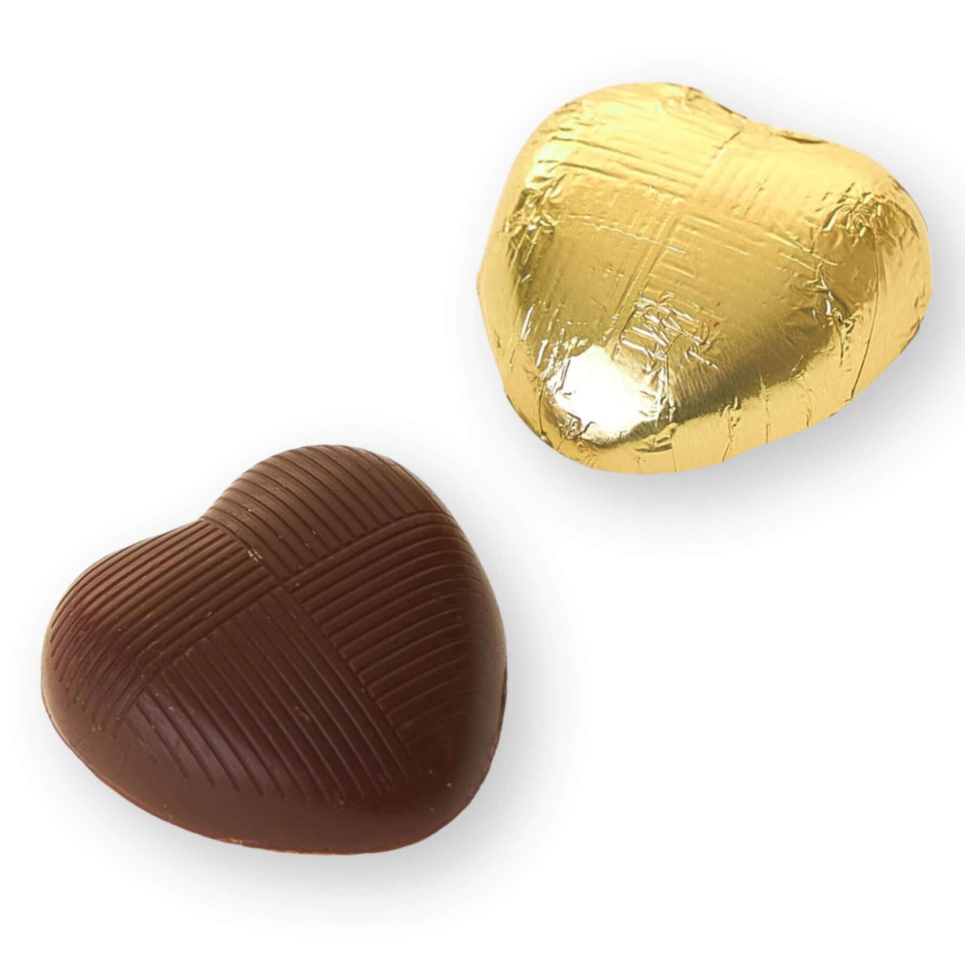 Chocolate heart with gold foil on a white background