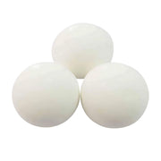 Three white ping pong balls on a white background