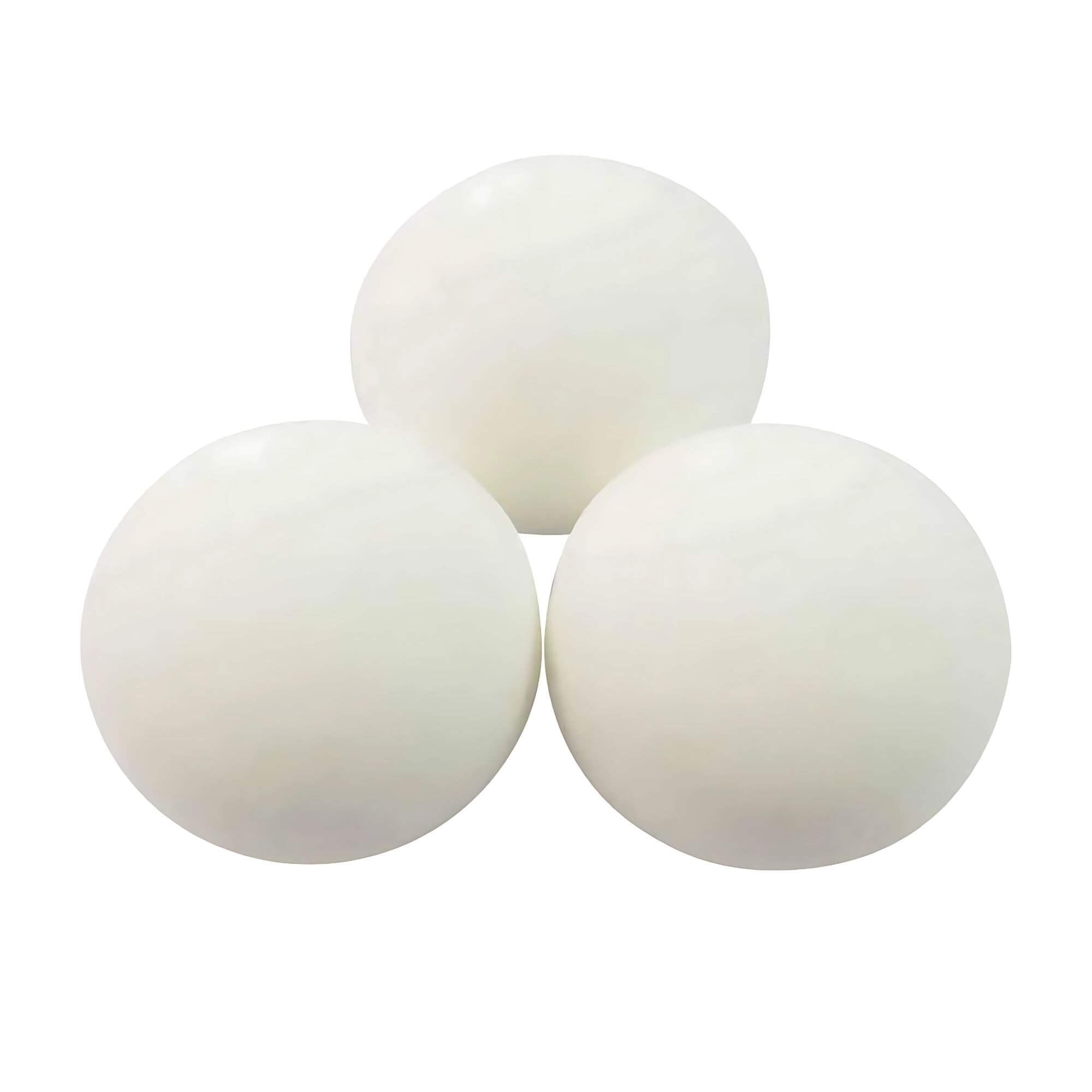 Three white ping pong balls on a white background