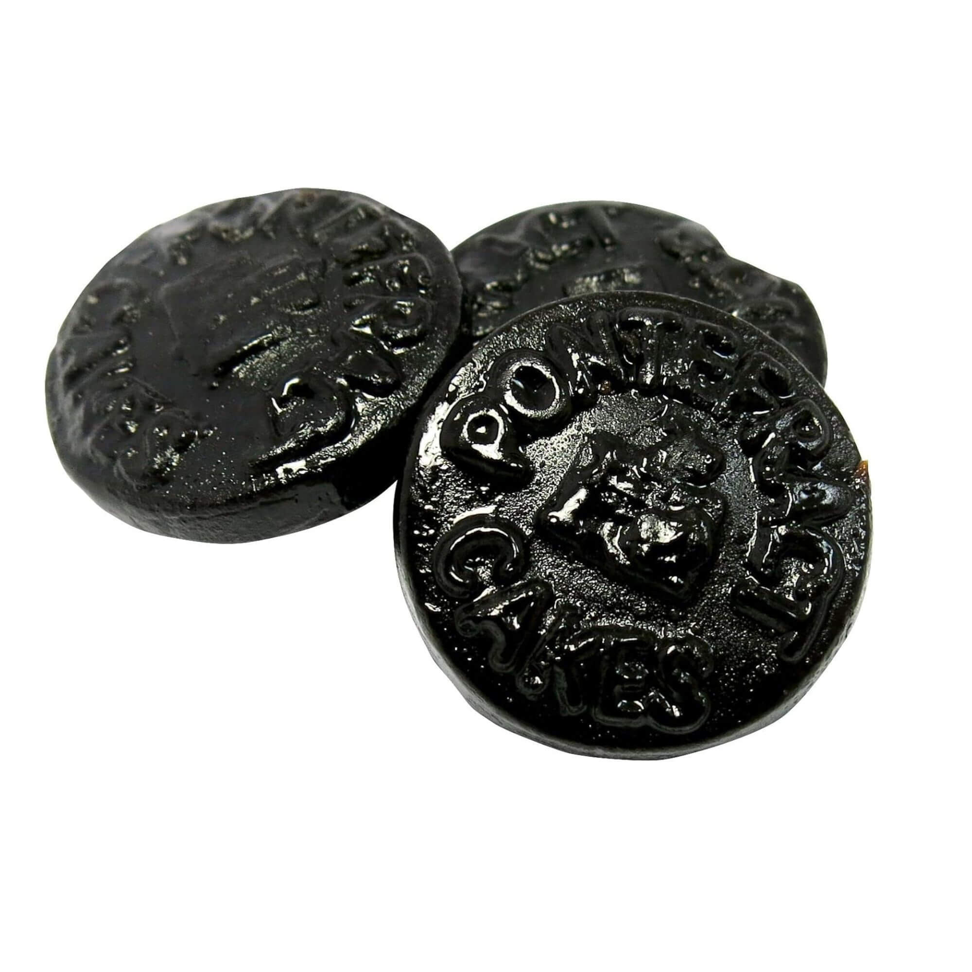 Three black Pontefract Cakes