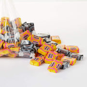 Assorted candy bars including Froot Loops and other brands on a white background