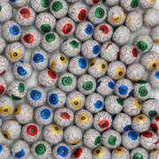 Multiple small eyeball toys with colored irises arranged in a pattern.