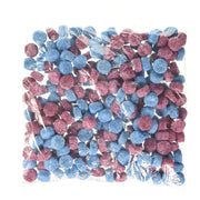 Bag of blue and pink gumballs on a white background