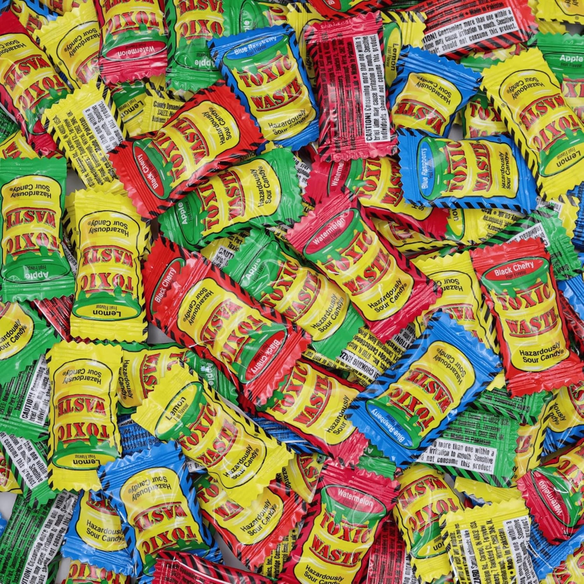 Assorted colorful packets of Toxic Waste candy